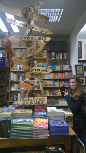 Me pointing at a sign for Diagon Alley in the book shop