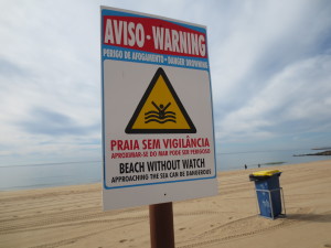 a sign in Portugal: "approaching the sea can be dangerous"