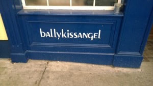 A sign reading "Ballykissangel" on a panel at the front of the pub.