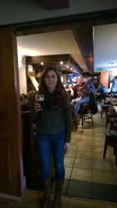 Me standing with a Guinness in the front bar of the pub.
