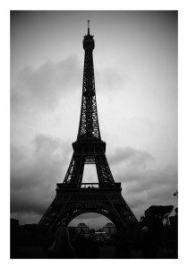 the Eiffel Tower in front of a cloudy sky