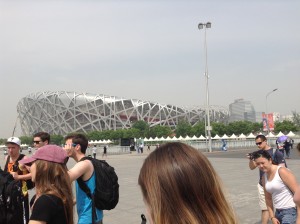 Walking through the Olympic Village, China's Bird's Nest is a staggering site, but smog clouds the view a bit.