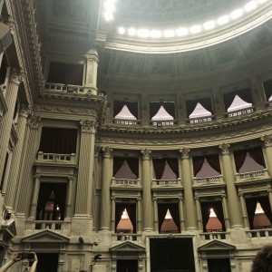 Congreso Nacional. Much of the room is illuminated by stained glass.