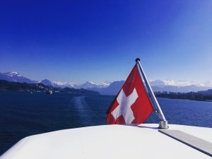Swiss flag and stunning blue skies from the boat tour 